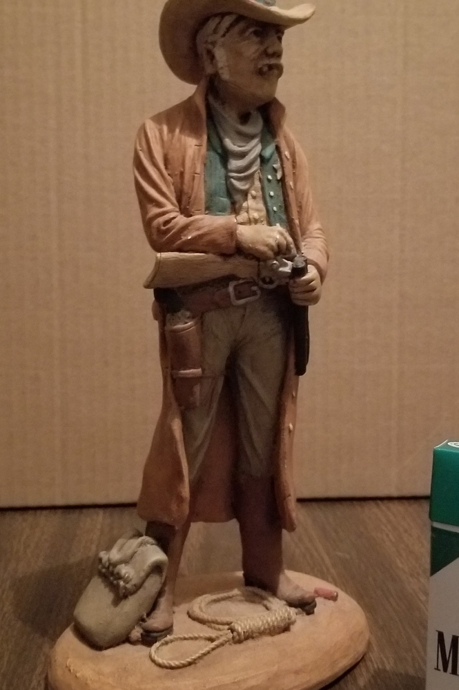 Gunslinger statue (height is next to cig pack)